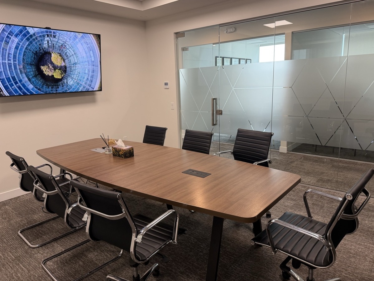 Boardroom with the full conference table and wall display