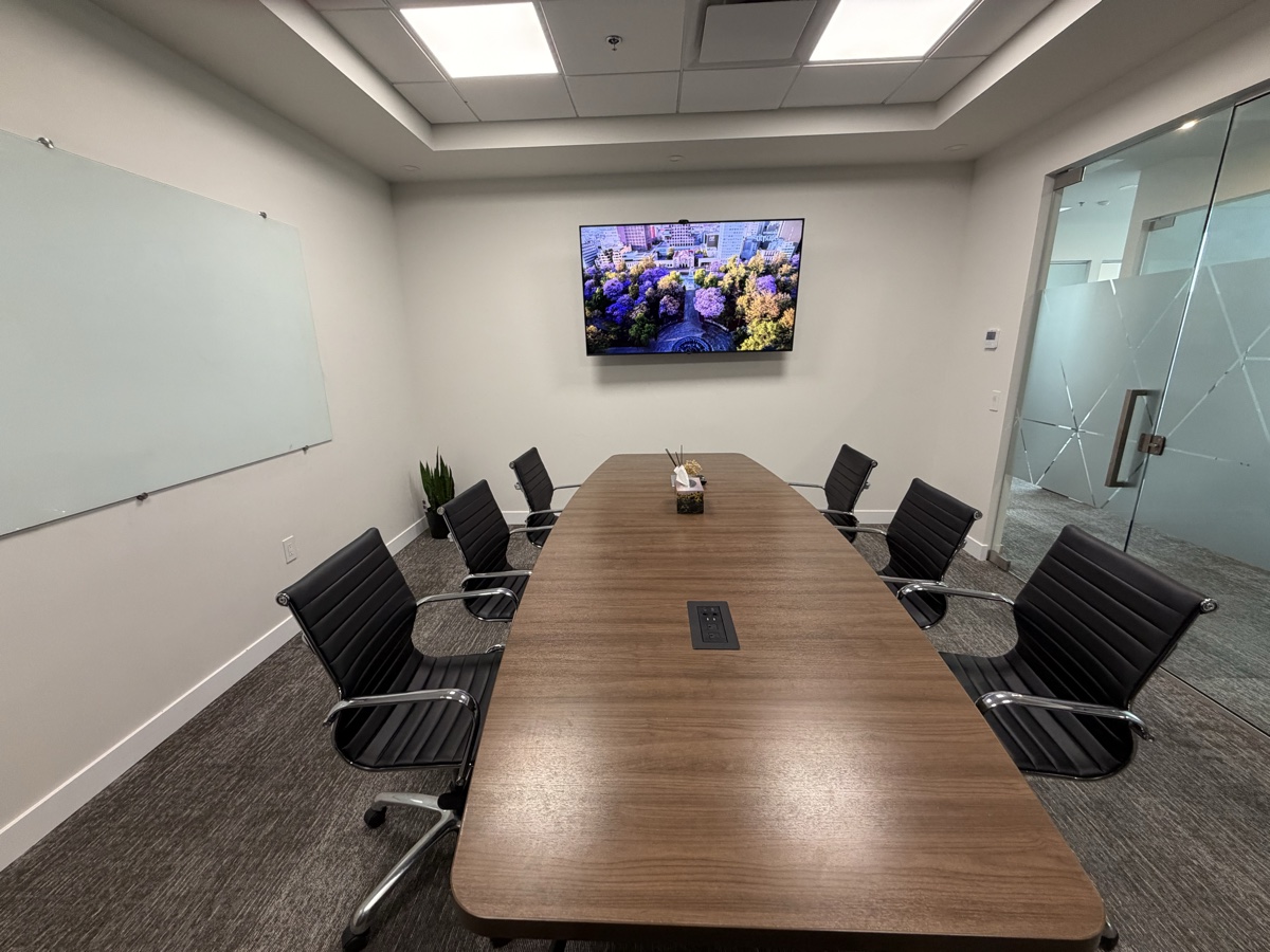Boardroom viewed head-on toward the display