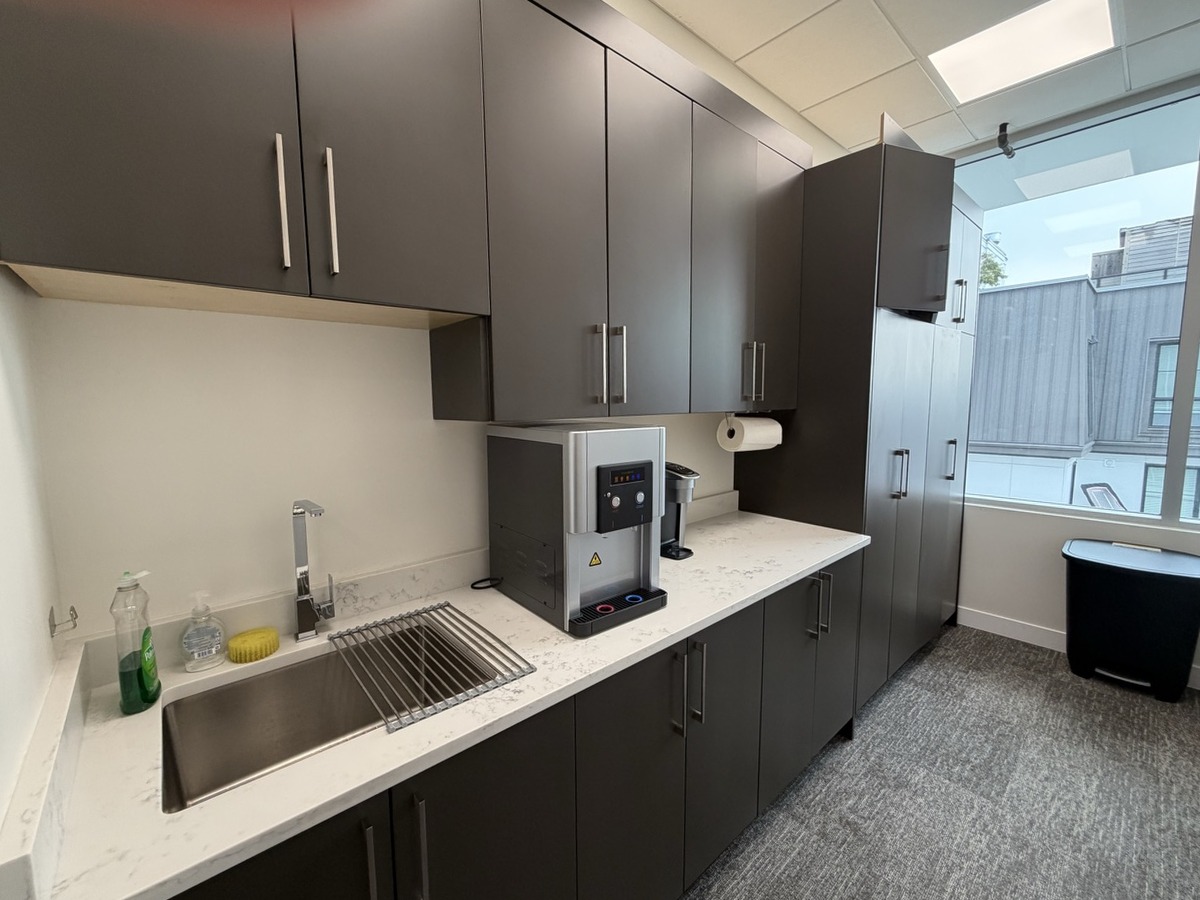 Kitchen lounge with fridge and natural light